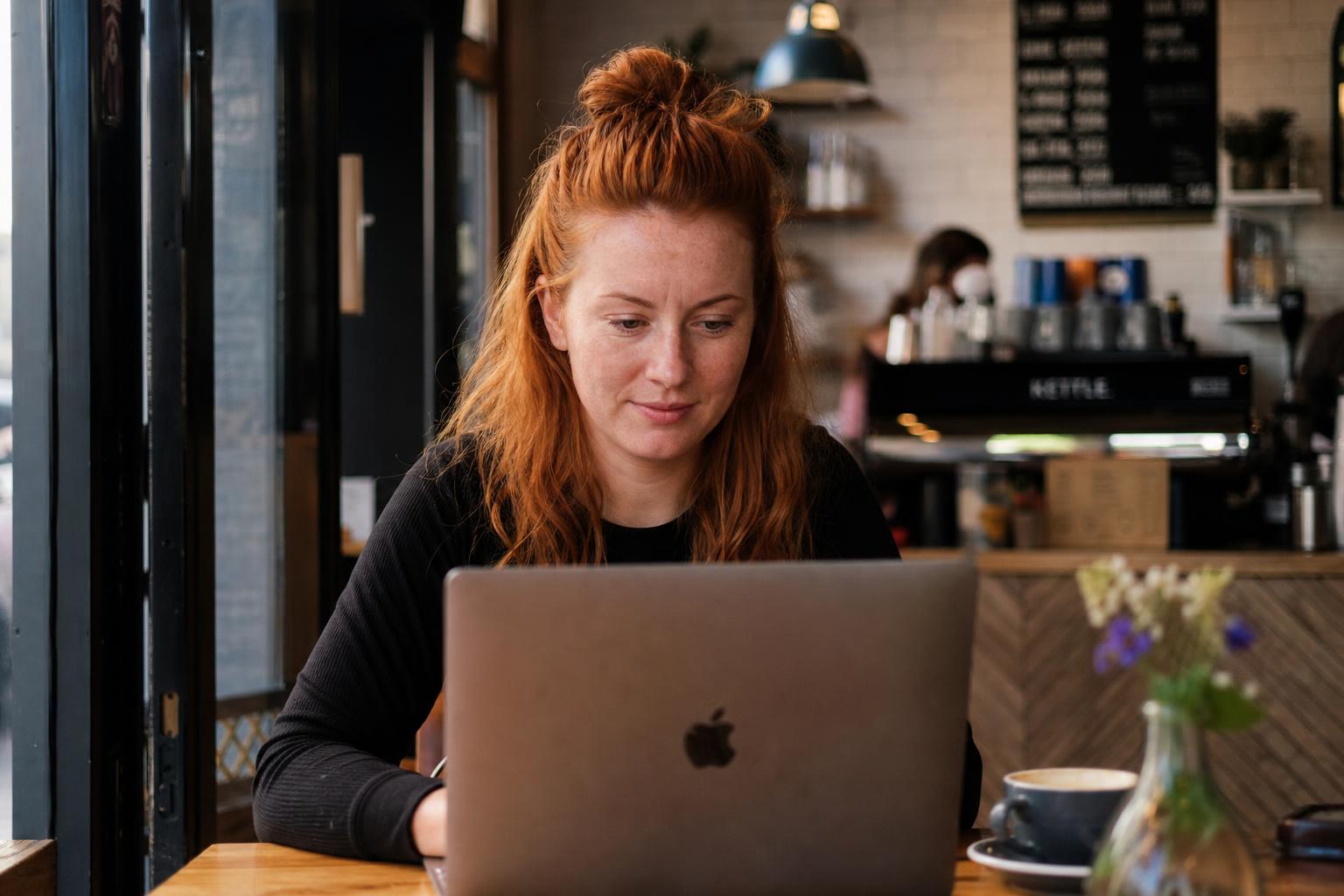 Shopify dashboard on laptop in cosy Irish boutique with EUR pricing — Digital Bridge 2026